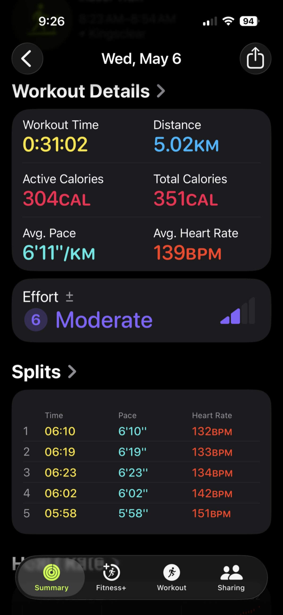 Runner on treadmill with earbuds during workout