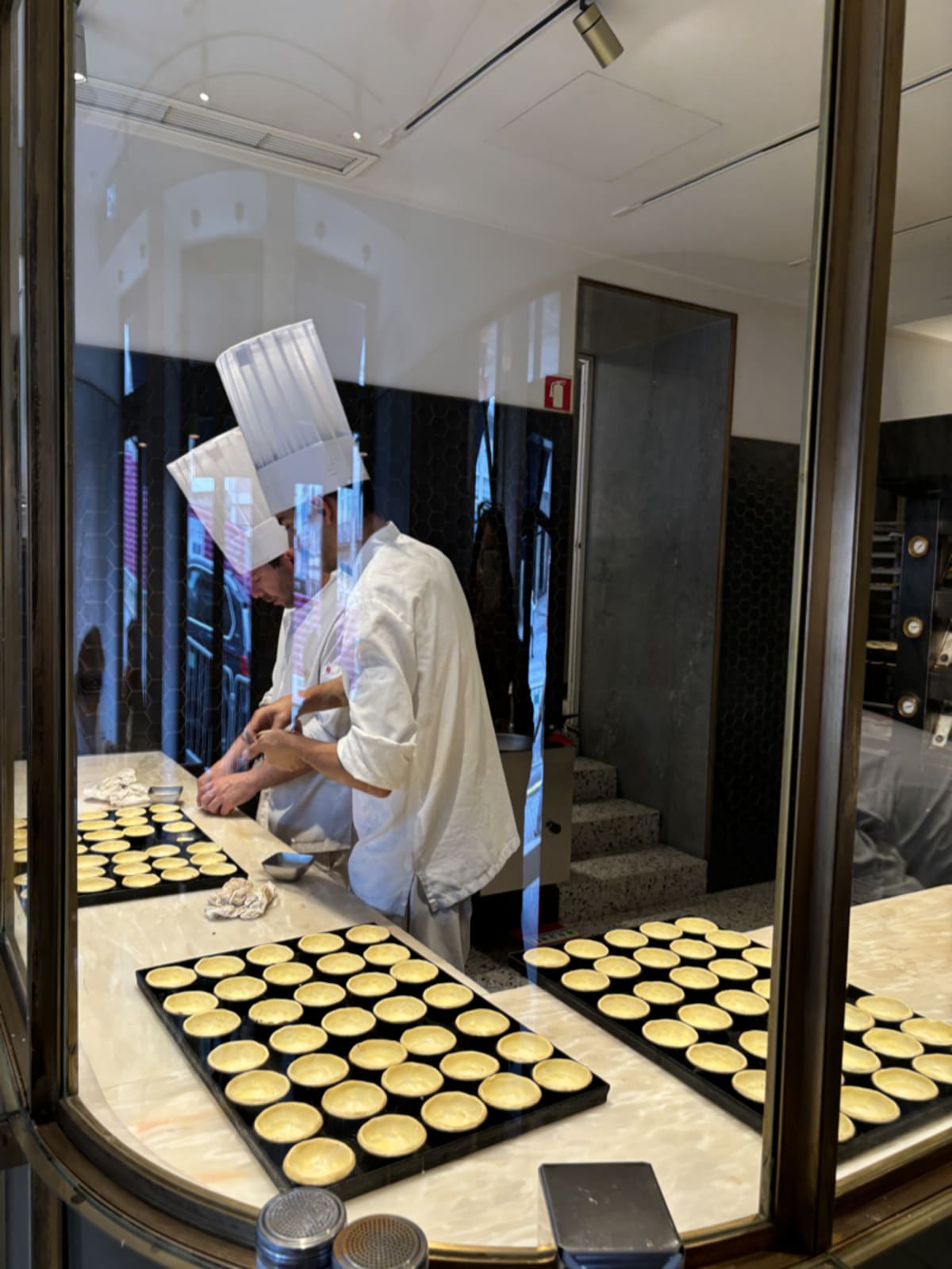 Assortment of Portuguese pastel de nata showcasing local Lisbon cuisine
