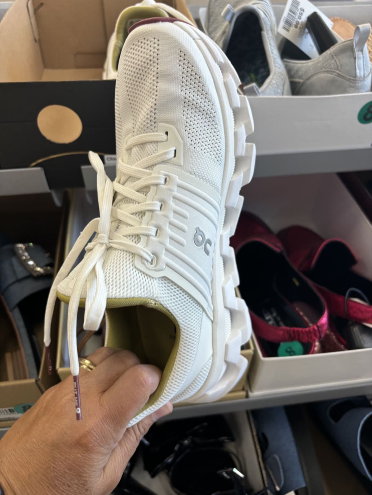 Collection of essential travel footwear including sneakers, sandals, and boots