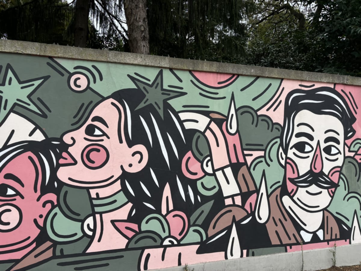 Colorful street art mural with vibrant geometric patterns