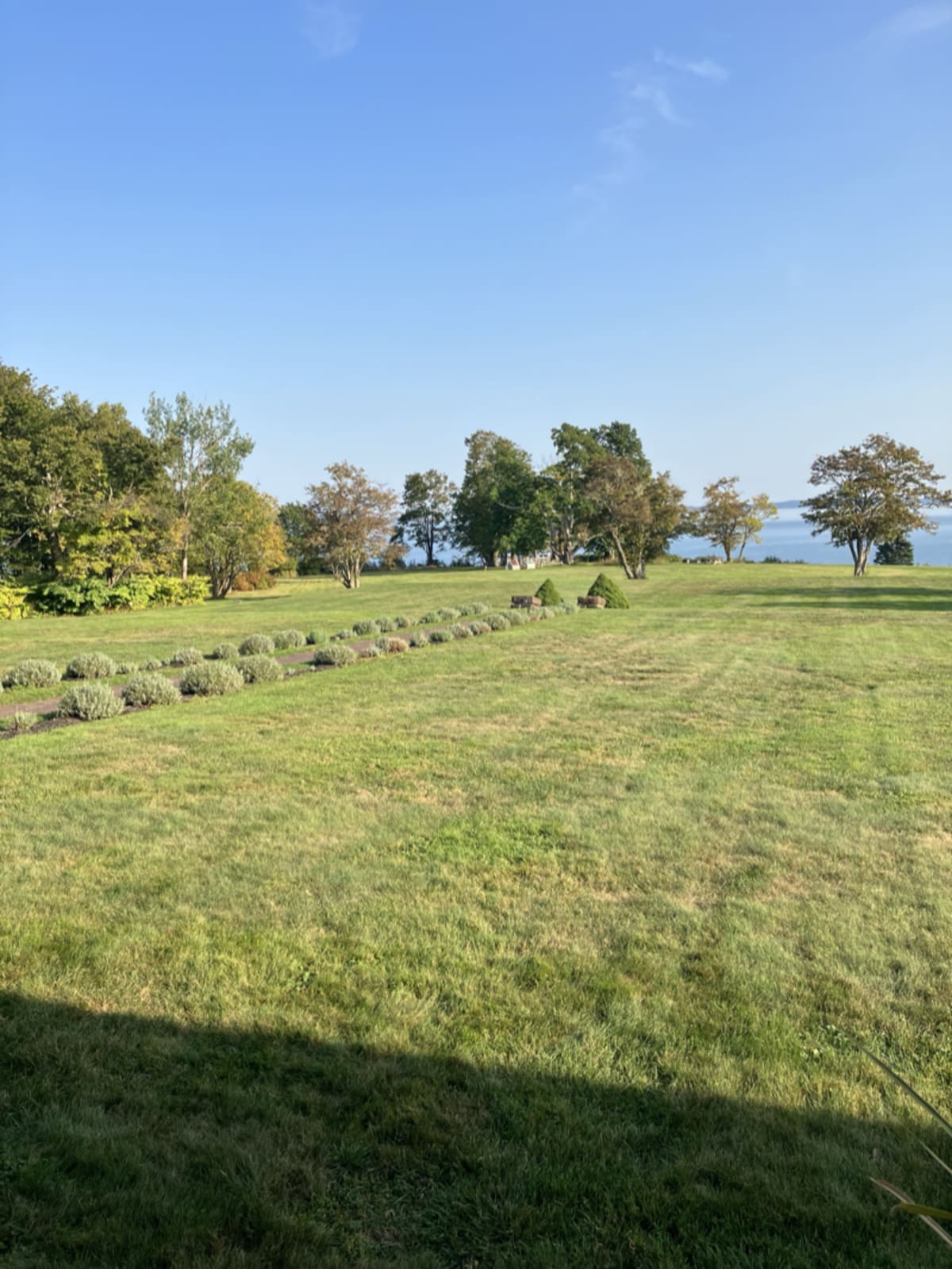 Beautiful garden on Ministers Island with lush greenery and historic charm