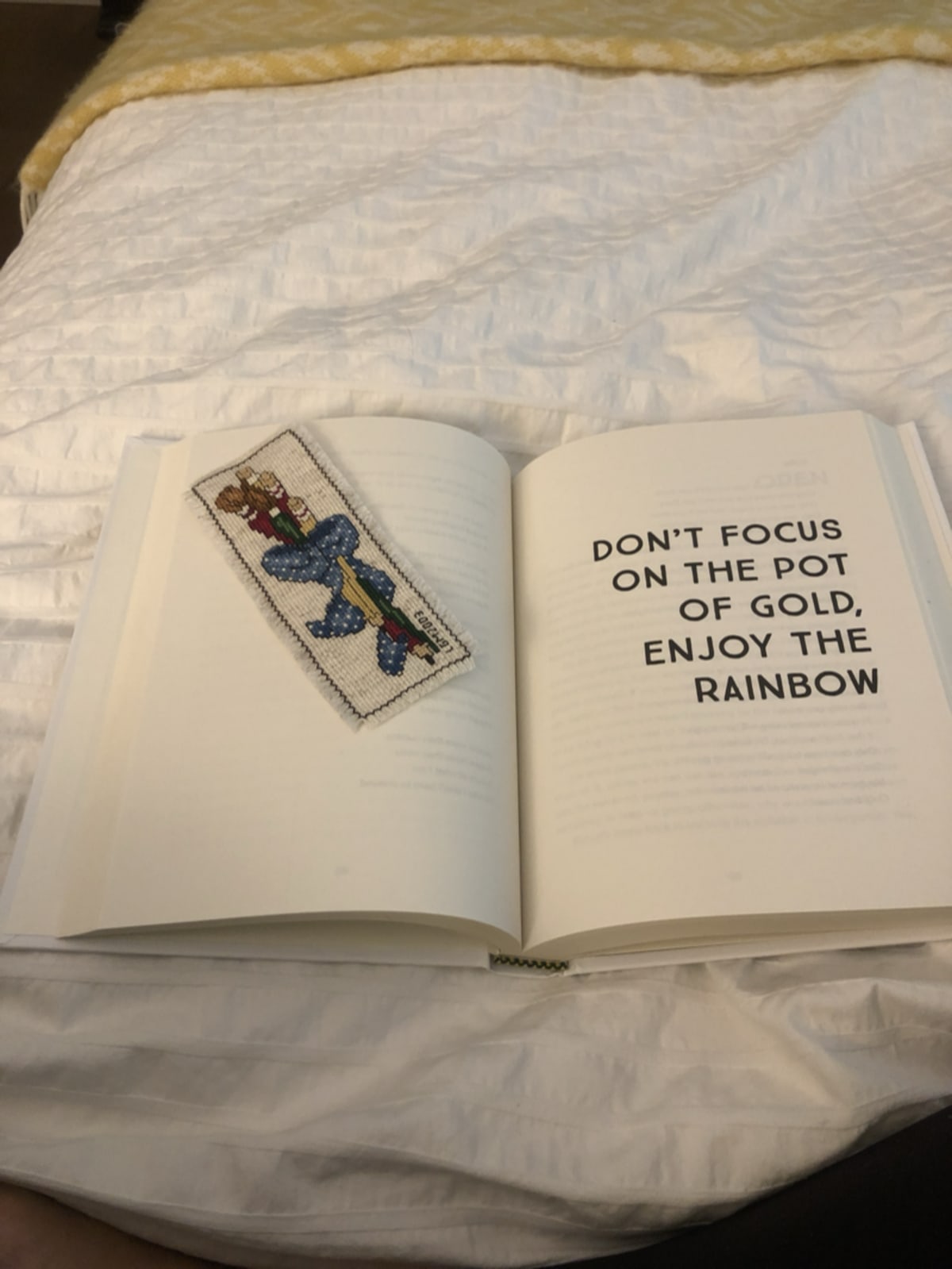 Book with rainbow illustration representing joy and kindness