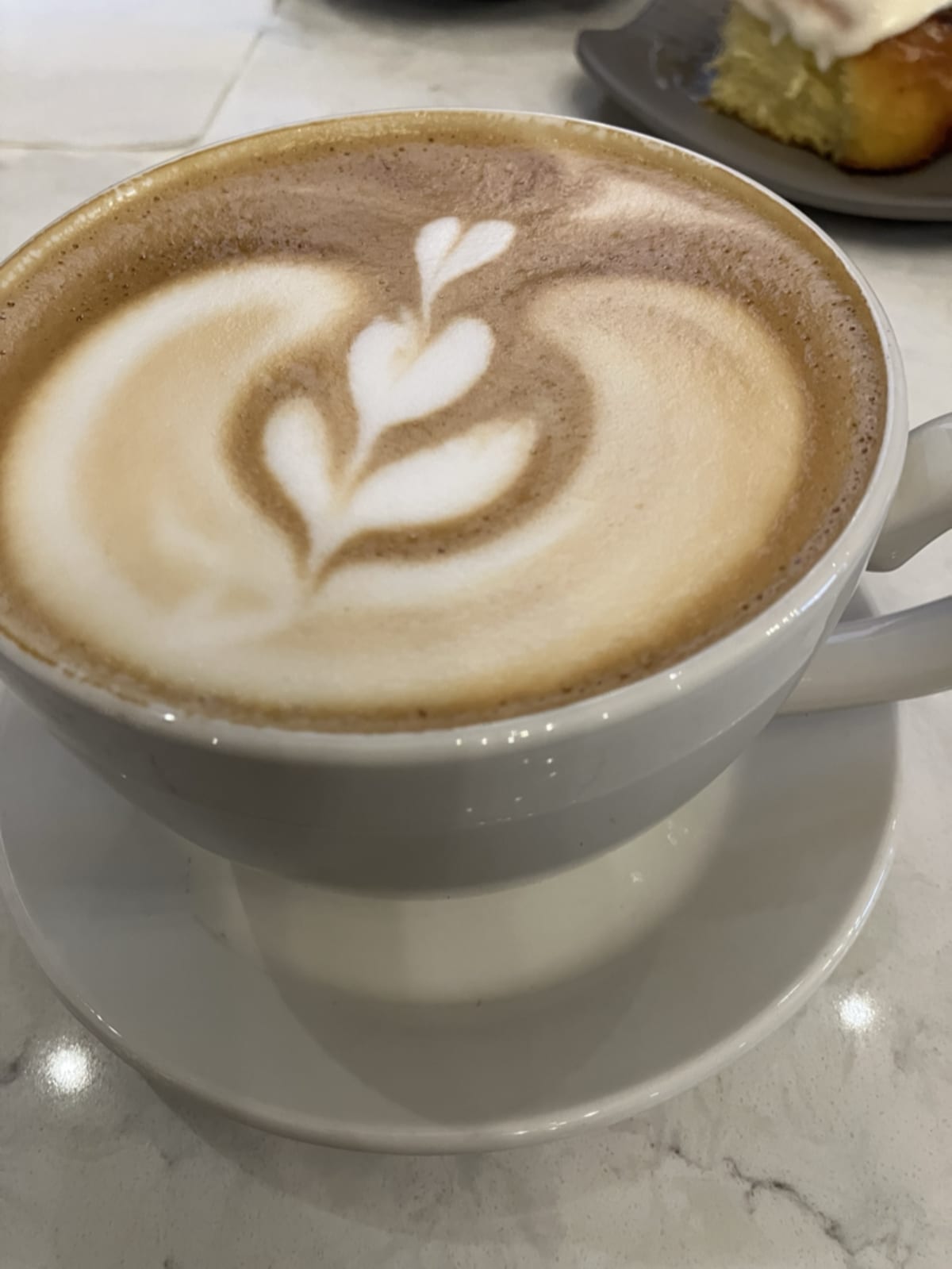 Latte with heart art from a local coffee shop