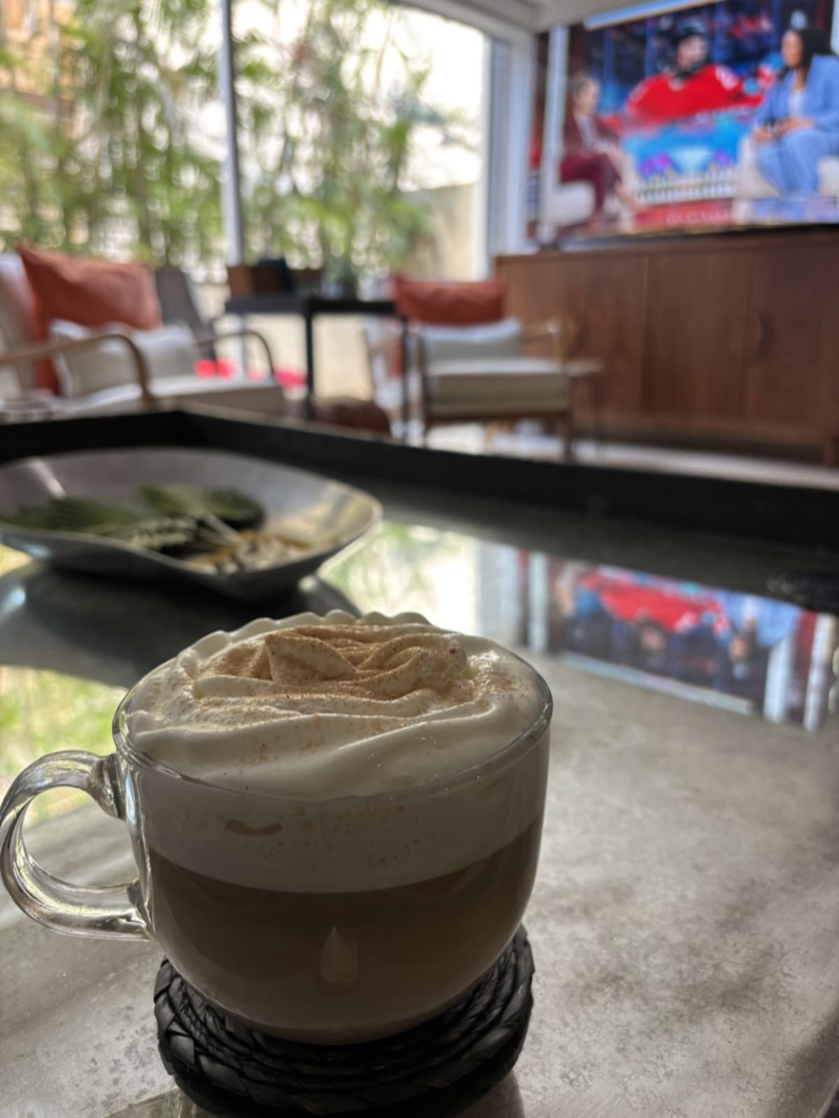 Coffee latte with sprinkles enjoyed during a restful moment