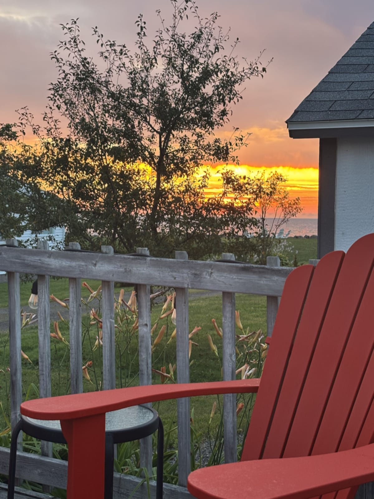Sunrise painting the sky with soft pink and orange colours over a calm morning horizon