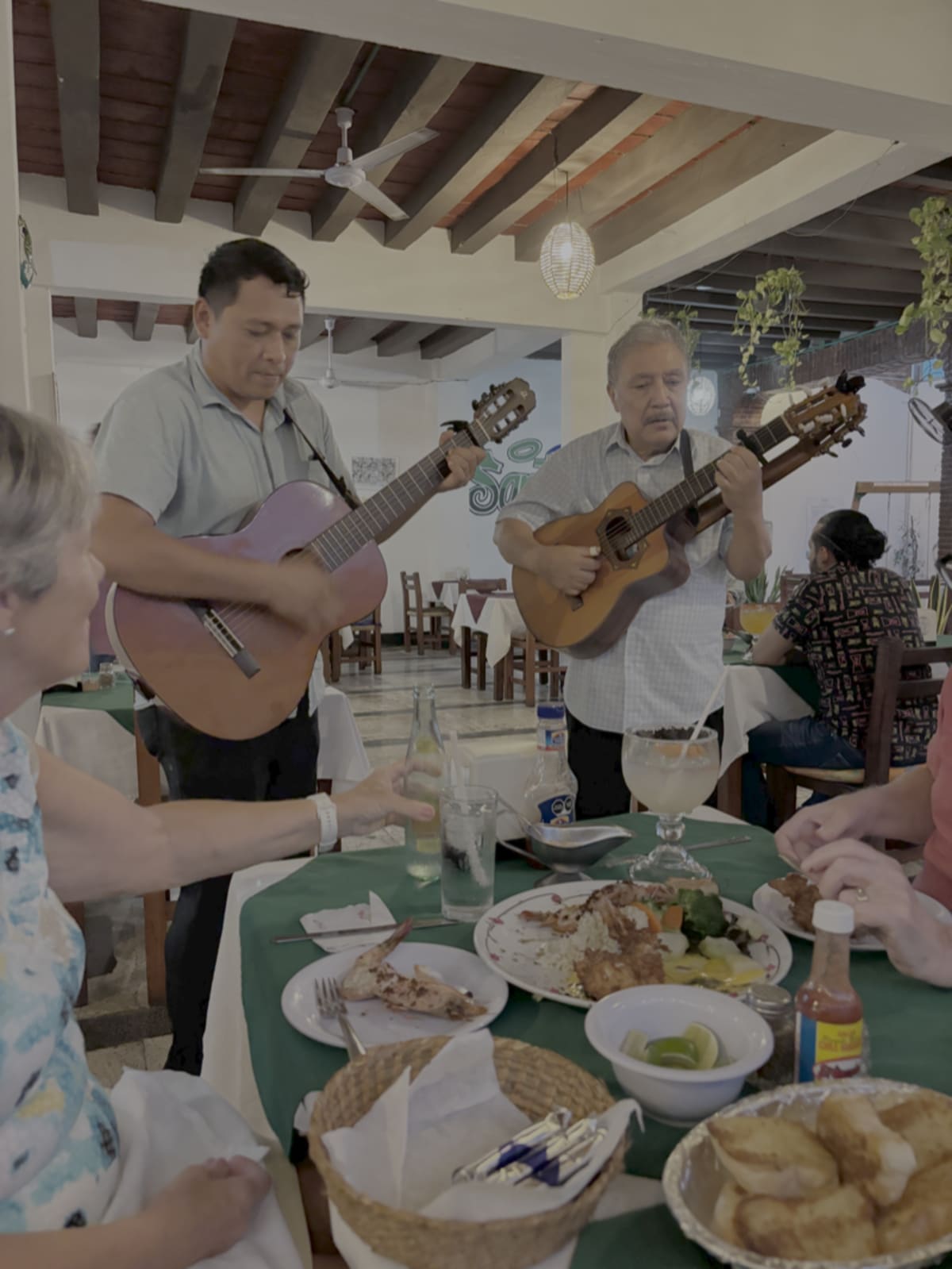 Musician sharing music and connection at a table