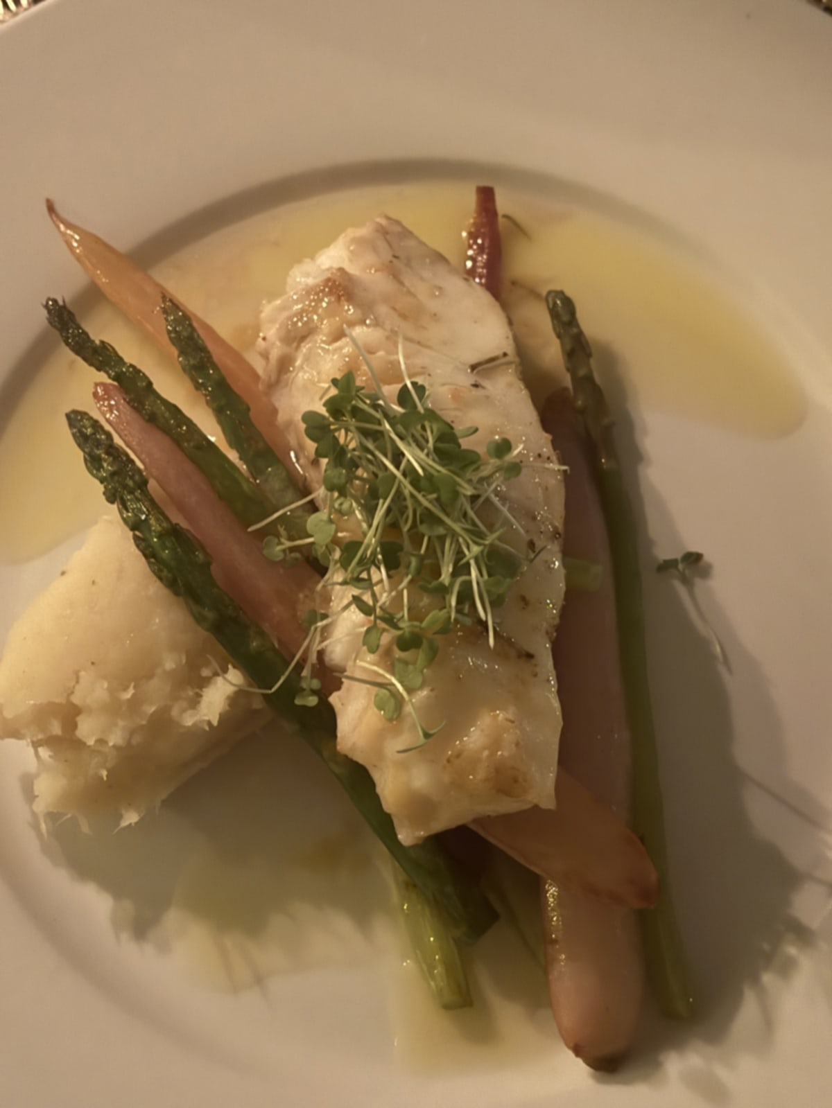 Freshly prepared halibut dish shared between foodie friends