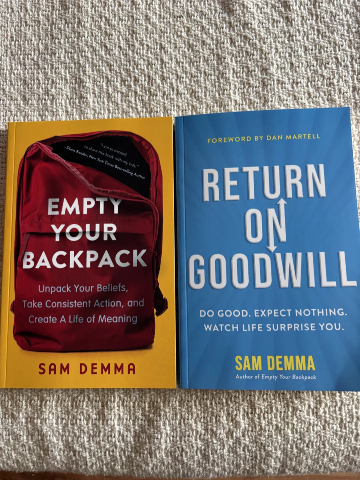Stack of Sam Demma's Return on Goodwill books at the launch event in Moncton