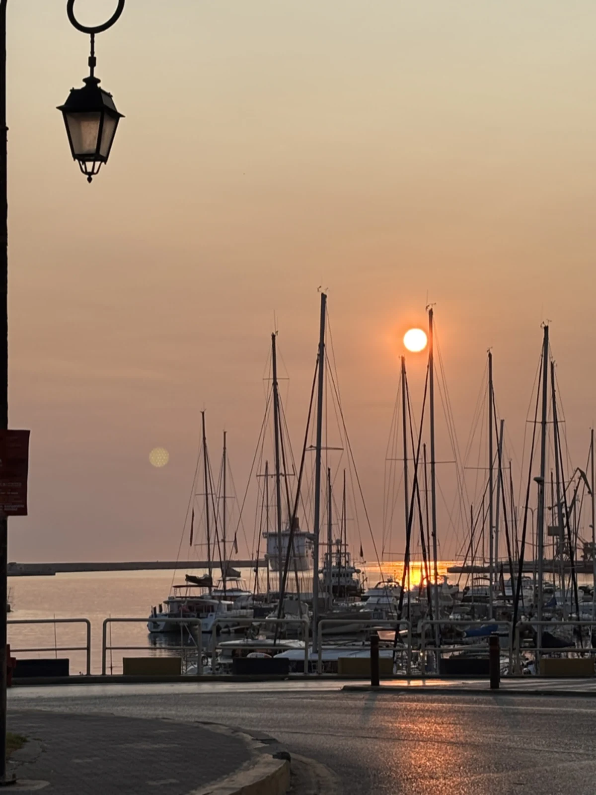 A quiet harbour view with boats drifting by — the kind of place worth sitting a while