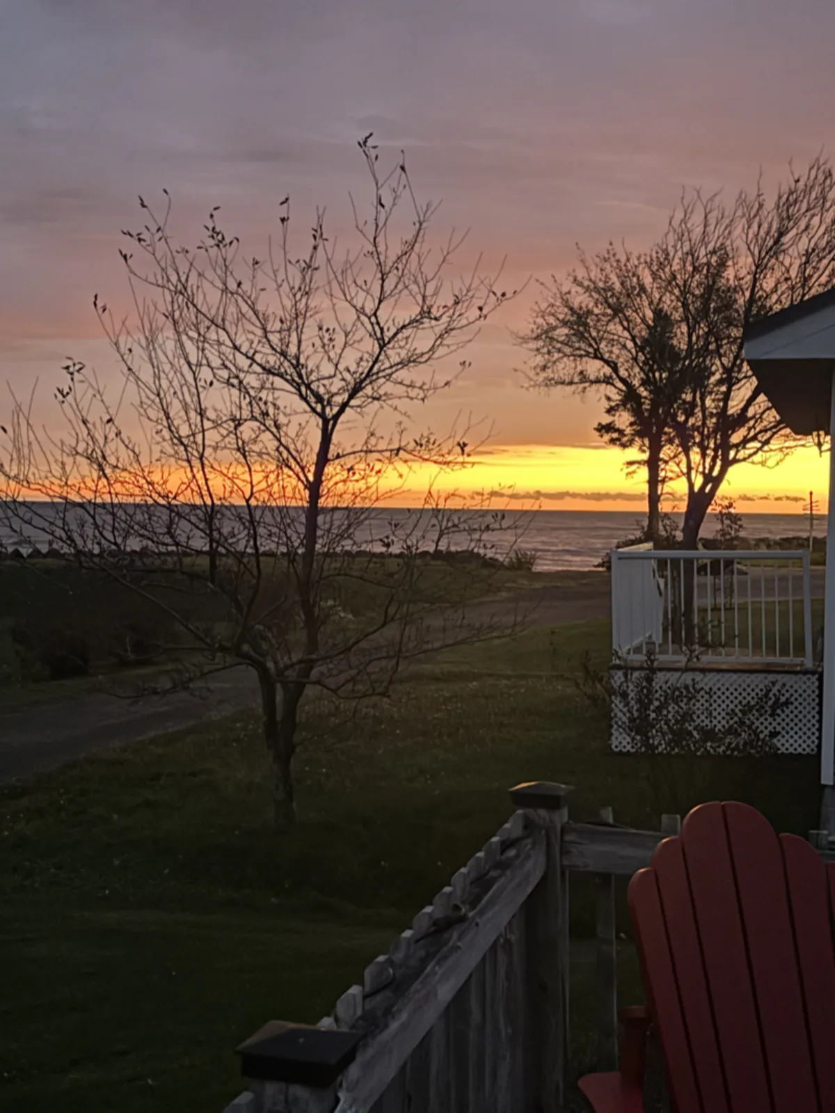 A warm sunset glowing over the water at the cottage